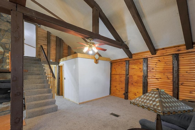 594 Suncook Valley Rd, Alton, NH 03809 - unfurnished living room with ceiling fan, carpet, wooden walls, stairway, and baseboards