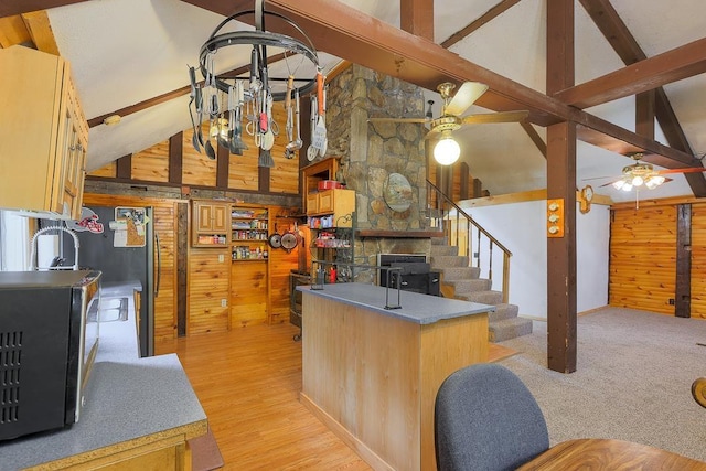 594 Suncook Valley Rd, Alton, NH 03809 - kitchen featuring wooden walls, high vaulted ceiling, a ceiling fan, stainless steel appliances, and beamed ceiling