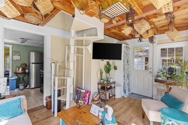 37 Robin St, Franklin, NH 03235 - living area with light wood finished floors and wood ceiling with exposed beams