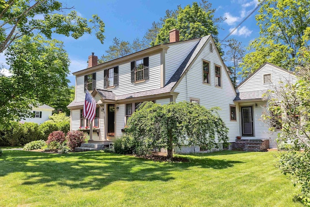3 Foundry St, Amherst, NH 03031 - traditional-style house with a chimney, a front lawn, and a shingled roof