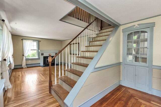 3 Foundry St, Amherst, NH 03031 - stairway featuring baseboard heating and a brick fireplace