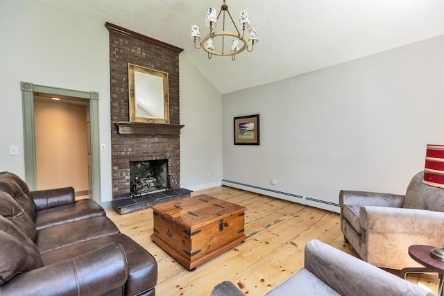 3 Foundry St, Amherst, NH 03031 - living area featuring light wood-style floors, a chandelier, high vaulted ceiling, a baseboard heating unit, and a fireplace