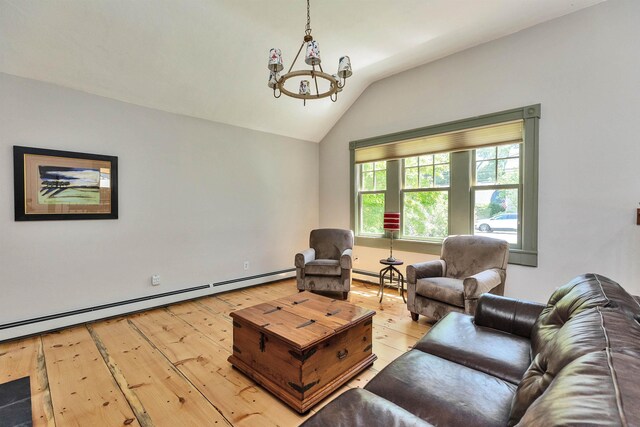 3 Foundry St, Amherst, NH 03031 - living area featuring lofted ceiling, a baseboard radiator, a chandelier, and wood-type flooring