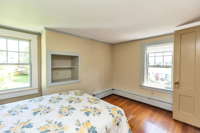 3 Foundry St, Amherst, NH 03031 - bedroom featuring multiple windows, crown molding, hardwood / wood-style floors, and baseboard heating