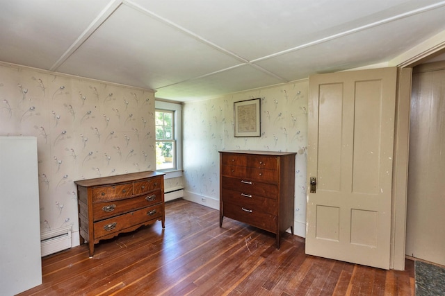 3 Foundry St, Amherst, NH 03031 - bedroom with dark wood-style flooring, baseboard heating, and wallpapered walls