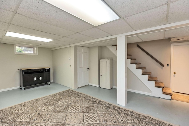 3 Foundry St, Amherst, NH 03031 - basement featuring a drop ceiling, baseboards, and stairway