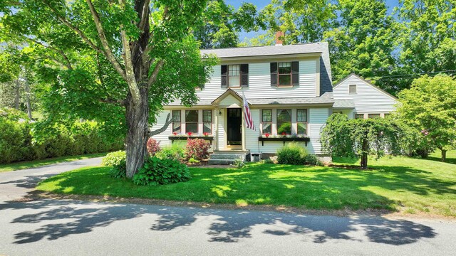 3 Foundry St, Amherst, NH 03031 - view of front of house featuring a front lawn, a chimney, and roof with shingles