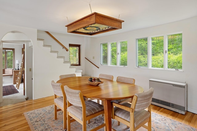 1065 Center Fayston Rd, Fayston, VT 05660 - dining area with stairway, arched walkways, and light wood-style floors