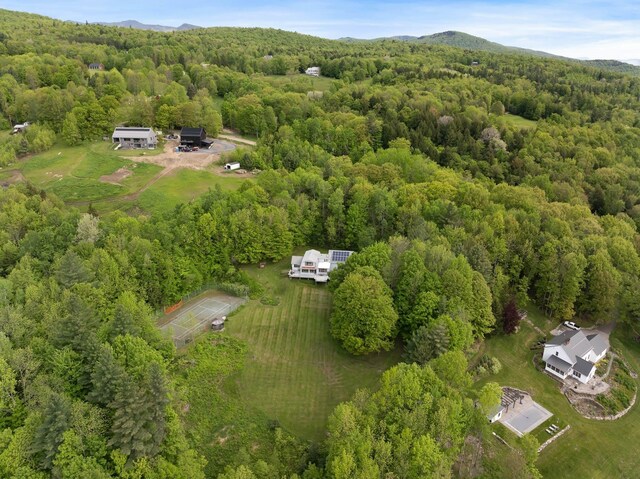 1065 Center Fayston Rd, Fayston, VT 05660 - aerial view of property's location with a heavily wooded area and a mountain backdrop