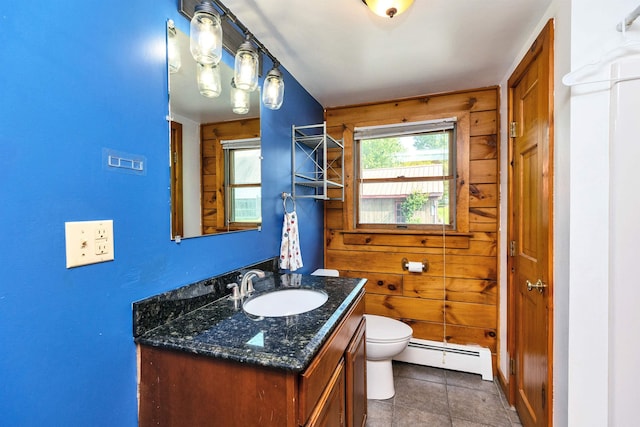 201 Deering Center Rd, Deering, NH 03244 - bathroom featuring baseboard heating, vanity, toilet, tile patterned flooring, and wood walls