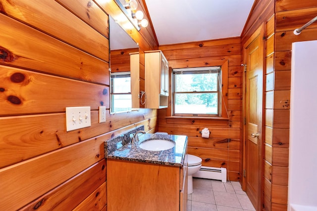 201 Deering Center Rd, Deering, NH 03244 - bathroom featuring a baseboard radiator, toilet, wooden walls, vanity, and tile patterned floors