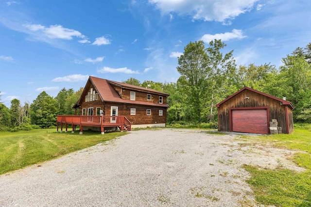 201 Deering Center Rd, Deering, NH 03244 - view of front of home featuring a detached garage, an outbuilding, a wooden deck, driveway, and a front yard