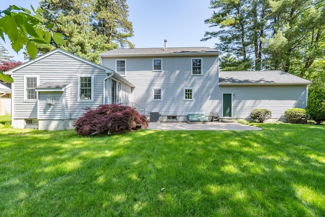4 Edith Ave, Nashua, NH 03064 - rear view of property featuring a patio, a yard, a shingled roof, and central air condition unit