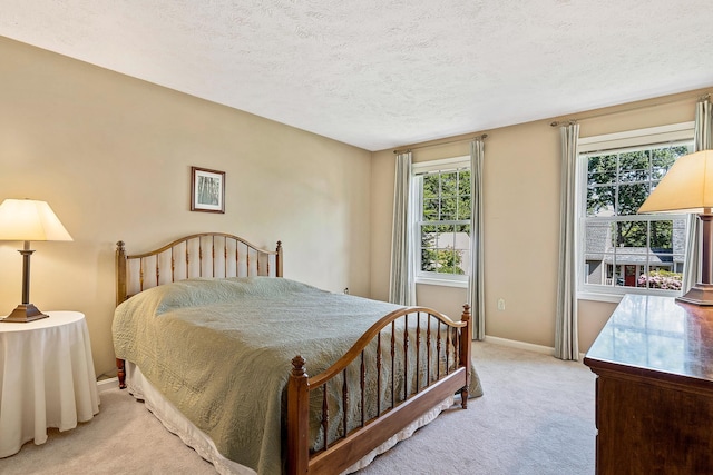 4 Edith Ave, Nashua, NH 03064 - bedroom featuring light carpet, a textured ceiling, and baseboards