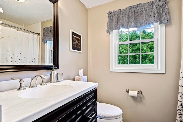 4 Edith Ave, Nashua, NH 03064 - bathroom with vanity, toilet, and a shower with shower curtain
