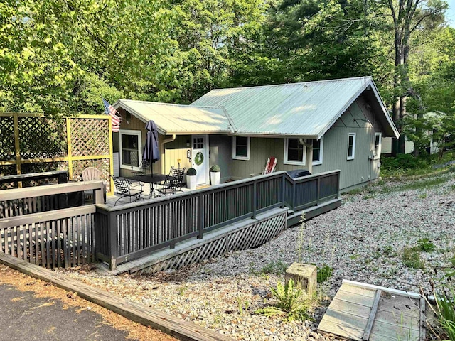 6 Chalet Dr, Gilford, NH 03249 - back of house featuring a deck and metal roof