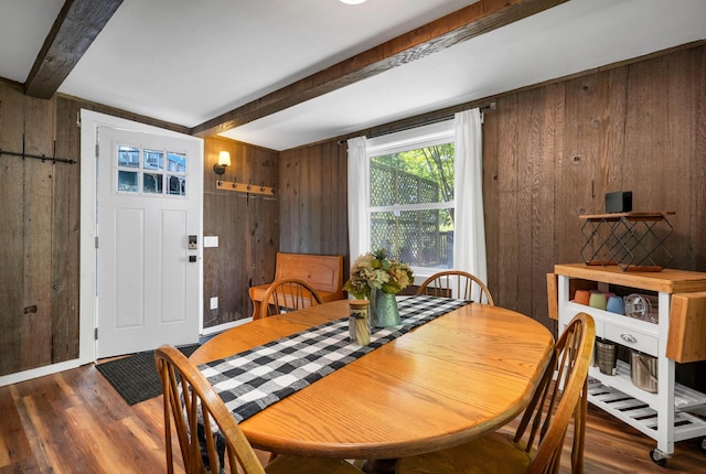 6 Chalet Dr, Gilford, NH 03249 - dining area with wooden walls, beamed ceiling, and wood finished floors