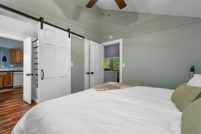6 Chalet Dr, Gilford, NH 03249 - bedroom with dark wood-style flooring, a barn door, ceiling fan, and high vaulted ceiling