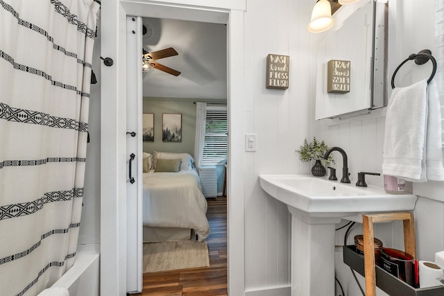 6 Chalet Dr, Gilford, NH 03249 - bathroom with wood finished floors, connected bathroom, shower / bath combo with shower curtain, and ceiling fan