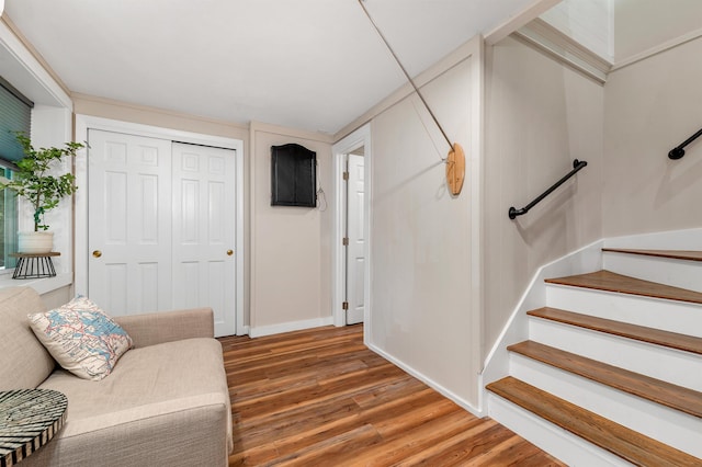 6 Chalet Dr, Gilford, NH 03249 - sitting room with light wood-style flooring, stairs, and baseboards