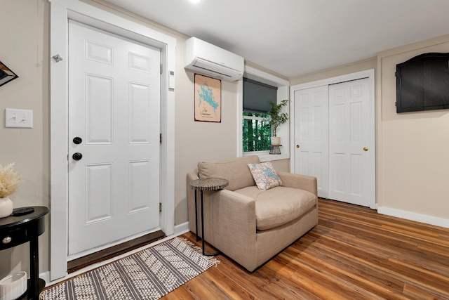 6 Chalet Dr, Gilford, NH 03249 - foyer with a wall unit AC, wood finished floors, and baseboards