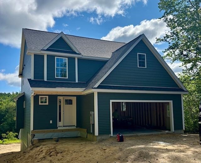 131 Badger Hill Rd, Milford, NH 03055 - view of front facade featuring a garage, driveway, and roof with shingles