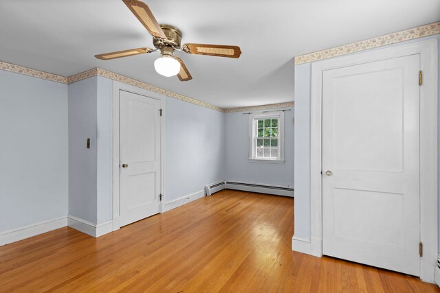 3 Patton St, Rochester, NH 03867 - unfurnished bedroom with baseboard heating, baseboards, light wood-style floors, and ceiling fan