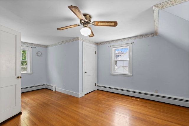 3 Patton St, Rochester, NH 03867 - unfurnished bedroom with baseboard heating, light wood-type flooring, ceiling fan, and baseboards