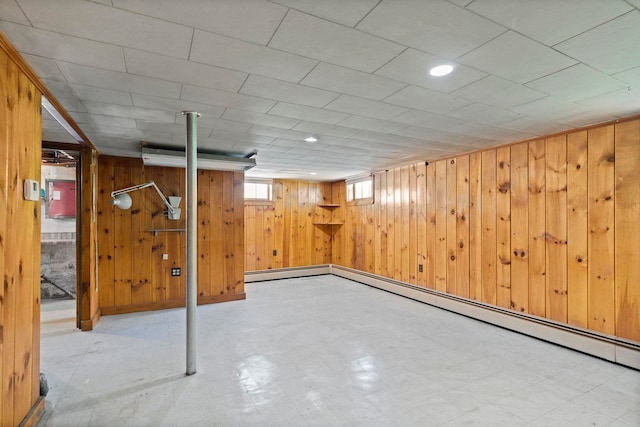 3 Patton St, Rochester, NH 03867 - below grade area featuring wood walls, tile patterned floors, and baseboard heating
