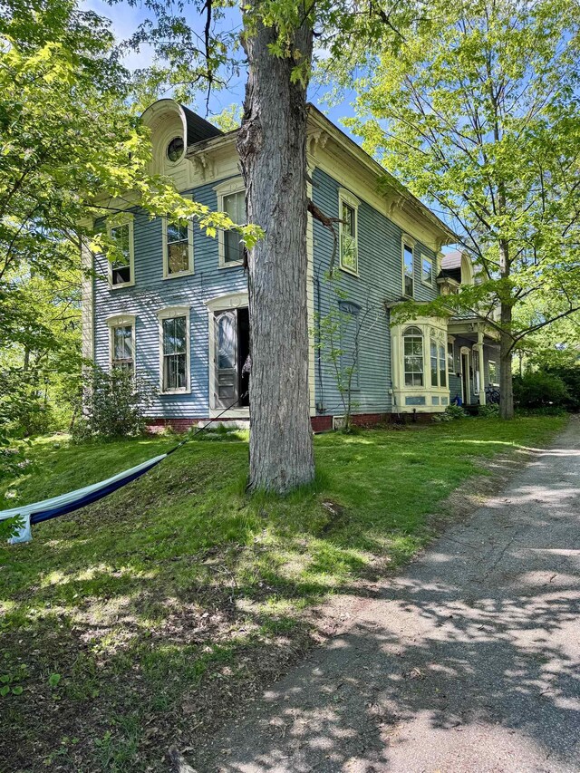 60 Bunker Hill St, Lancaster, NH 03584 - view of side of property featuring a yard