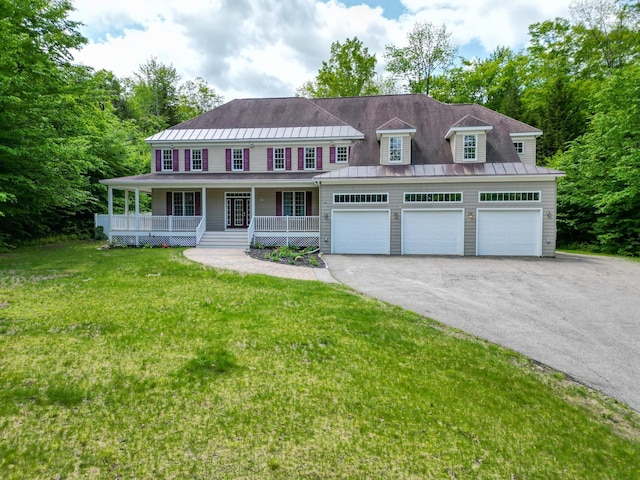 244 Rolling Ridge Rd, Bartlett, NH 03812 - view of front facade with a porch, a standing seam roof, a front lawn, asphalt driveway, and a garage