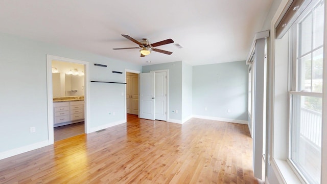 5 Callaway Dr Unit 2, Concord, NH 03301 - unfurnished bedroom featuring light wood-type flooring, baseboards, ensuite bathroom, and a ceiling fan