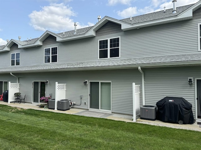 5 Callaway Dr Unit 2, Concord, NH 03301 - rear view of house with a lawn, a patio area, and central AC unit