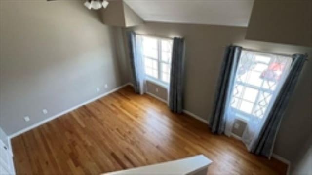 24 Bandon Cir, Westford, MA 01886 - unfurnished living room with wood finished floors and baseboards