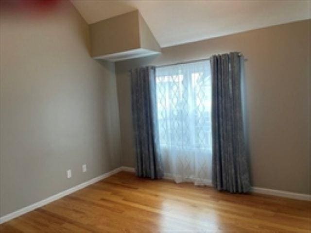 24 Bandon Cir, Westford, MA 01886 - empty room featuring wood finished floors and baseboards