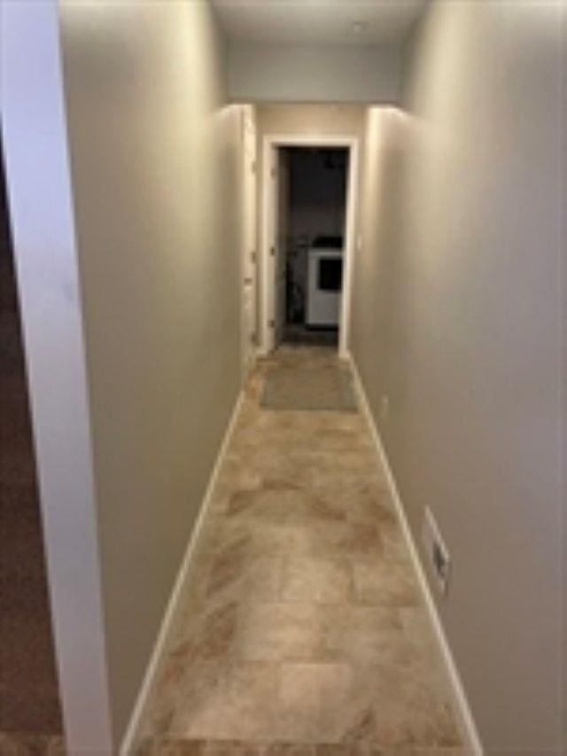 24 Bandon Cir, Westford, MA 01886 - corridor with baseboards and light stone finish flooring