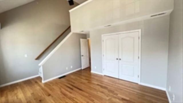24 Bandon Cir, Westford, MA 01886 - unfurnished living room with wood finished floors and baseboards