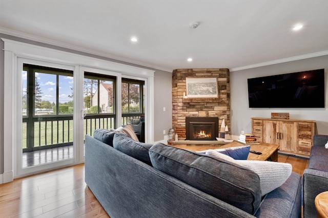 60 Weirs Rd Unit H1, Gilford, NH 03249 - living area with crown molding, wood finished floors, a stone fireplace, and recessed lighting