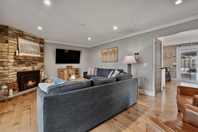 60 Weirs Rd Unit H1, Gilford, NH 03249 - living area with ornamental molding, light wood finished floors, a fireplace, recessed lighting, and baseboards