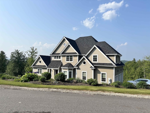 4 Mountain Ridge Dr, Meredith, NH 03253 - view of front facade with a garage and roof with shingles