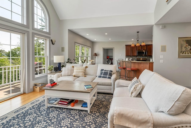 4 Mountain Ridge Dr, Meredith, NH 03253 - living area with light wood-type flooring, recessed lighting, lofted ceiling, and a chandelier