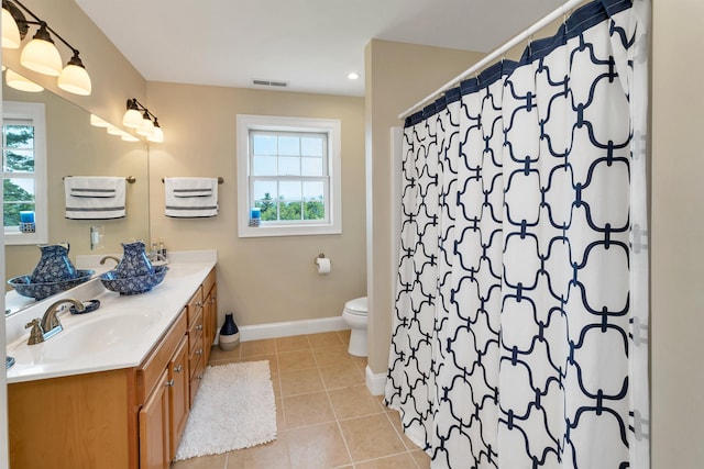 4 Mountain Ridge Dr, Meredith, NH 03253 - full bathroom with double vanity, tile patterned floors, toilet, baseboards, and curtained shower
