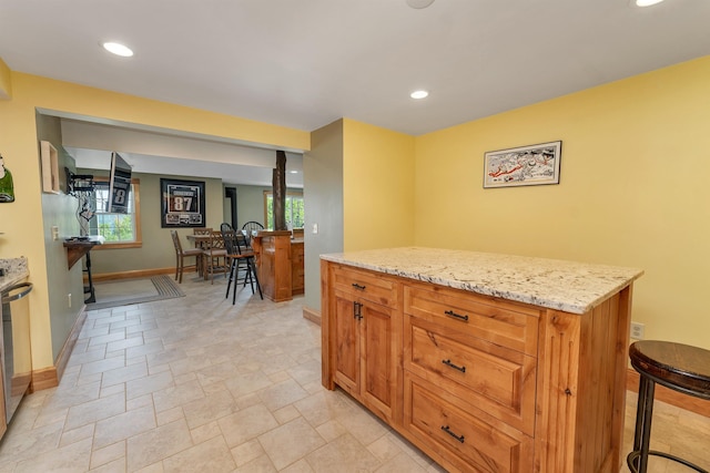 4 Mountain Ridge Dr, Meredith, NH 03253 - kitchen featuring baseboards, light stone countertops, recessed lighting, light stone finish floors, and brown cabinetry