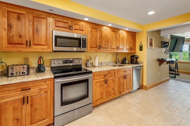 4 Mountain Ridge Dr, Meredith, NH 03253 - kitchen with appliances with stainless steel finishes, a sink, baseboards, recessed lighting, and brown cabinetry