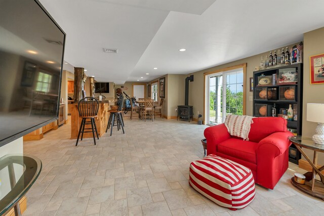4 Mountain Ridge Dr, Meredith, NH 03253 - living room with a wood stove, stone finish floors, and recessed lighting