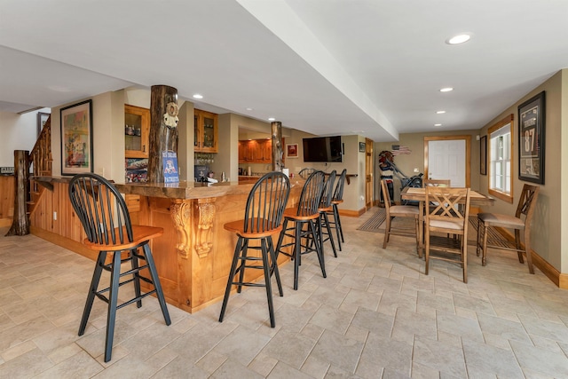 4 Mountain Ridge Dr, Meredith, NH 03253 - indoor wet bar with baseboards, light stone finish floors, and recessed lighting