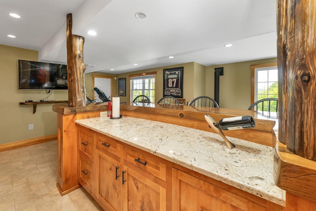 4 Mountain Ridge Dr, Meredith, NH 03253 - kitchen featuring recessed lighting, baseboards, healthy amount of natural light, and light stone counters
