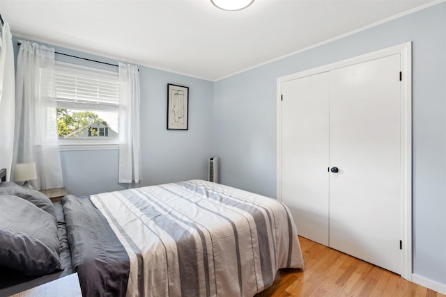 45 Cohas Ave, Manchester, NH 03109 - bedroom featuring light wood-type flooring, crown molding, and a closet