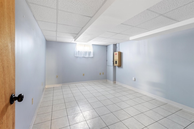 45 Cohas Ave, Manchester, NH 03109 - basement featuring a paneled ceiling and light tile patterned floors