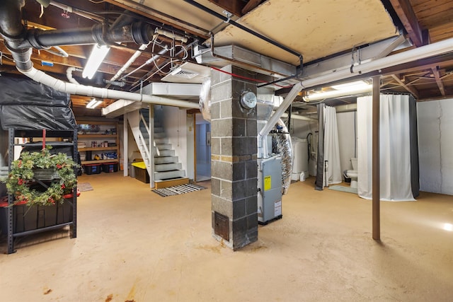 45 Cohas Ave, Manchester, NH 03109 - unfinished below grade area featuring stairs and heating unit